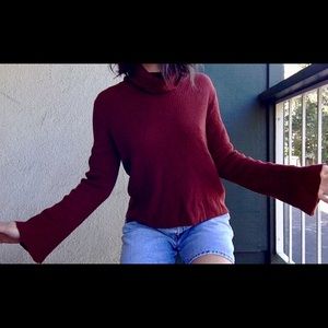 Cowl neck sweater featuring bell sleeves